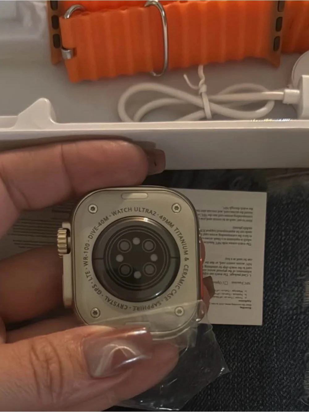Smartwatch with Orange Sport Band and Silver Case - Sleek Touchscreen Wearable